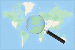 Map of the world with a magnifying glass on a map of Gibraltar. vector