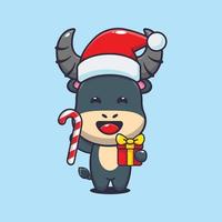 Cute buffalo holding christmas candy and gift. Cute christmas cartoon illustration. vector