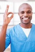 Surgeon gesturing OK. photo