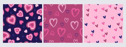 Set of seamless patterns with hearts in blue and pink colors. Vector graphics.