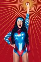 She is number one Beautiful young woman in superhero costume keeping arm outstretched and mouth open while standing against red background photo