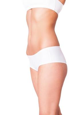 Beautiful body in shape. Side view cropped image of woman in white bra and  panties standing isolated on white 13524360 Stock Photo at Vecteezy