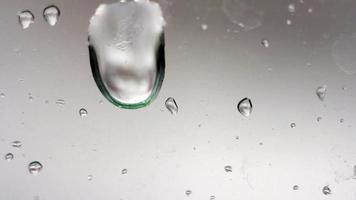 drops of rain running down the glass video