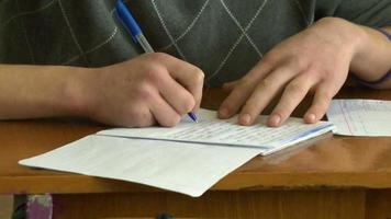 human hand writing pen in notebook video