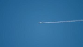 Airplane flying at high altitude with contrail video