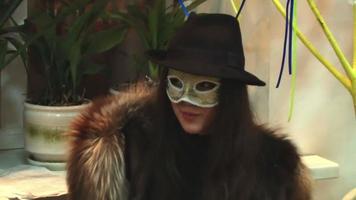 girl in golden mask talking with someone video
