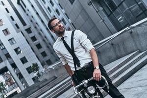 No gym membership needed. Good looking young man in full suit looking away while standing outdoors photo