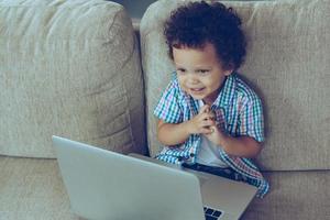 Boy with laptop photo