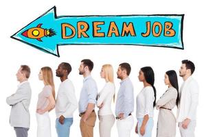 In search of dream job. Side view of confident diverse group of people in smart casual wear looking away while standing in a row and against white background photo