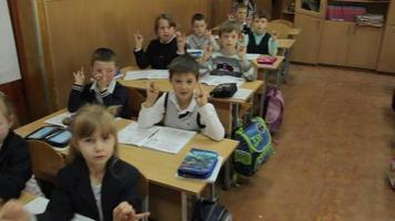 teacher and students in class at primary school classroom video