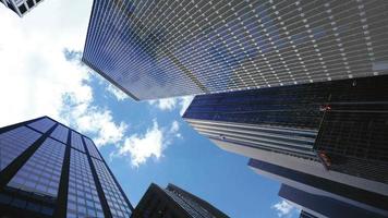 clouds flying over skyscrapers video