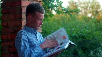 Boy studying with books video