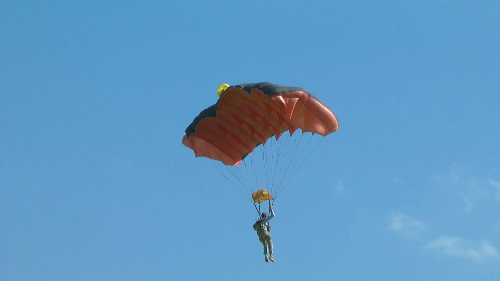 parachutist lands on the ground 13541886 Stock Video at Vecteezy