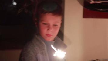 Boy lights a sparkler at night dramatization of a global cataclysm, turn off the electricity video