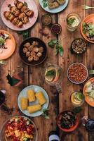 Enjoy your dinner Top view of food and drinks on the rustic wooden table photo