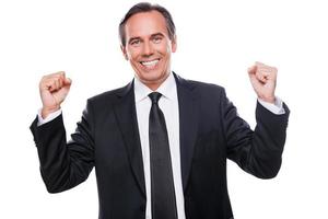 Happy businessman. Happy mature man in formalwear gesturing and smiling while standing isolated on white background photo