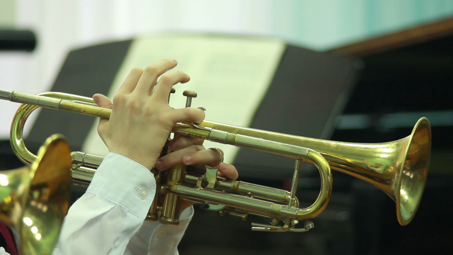 man's hands playing a wind instrument 13551873 Stock Video at Vecteezy