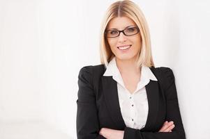 Confident mature businesswoman. Confident mature businesswoman keeping arms crossed and smiling photo