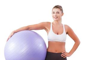 Beauty with exercise ball. Beautiful mature woman holding fitness ball and smiling at camera photo