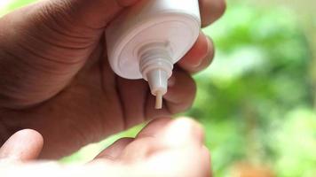 Close up of sunscreen squeezed into hand video