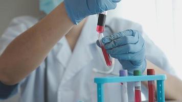 Medical Research Laboratory Portrait of a Female Scientist Wearing Face Mask Using Micro Pipette for Analysis. Advanced Scientific Lab for Medicine, Biotechnology Development. Close-up Shot video