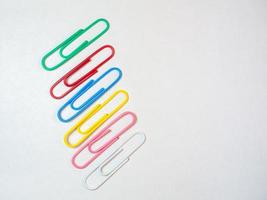 Large multi-colored paper clips. Paperclip of documents.   Bright stationery photo