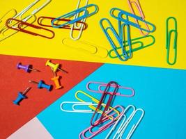 Paper work. Colored paper clips. Work with documents.  Stationery. photo