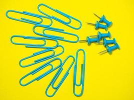 Paper work. Colored paper clips. Work with documents.   Colorful office supplies. photo