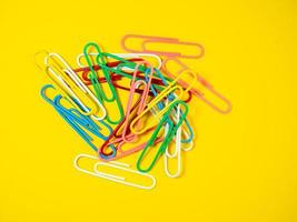 Large multi-colored paper clips. Paperclip of documents.  Bright stationery photo