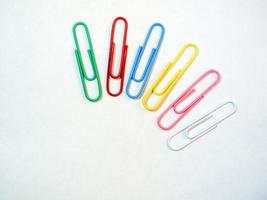 Large multi-colored paper clips. Paperclip of documents. Desktop. photo