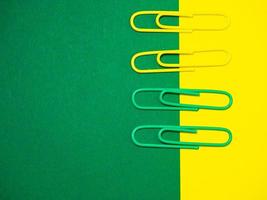 Paper work. Colored paper clips. Colored paper with staples. Work with documents. Office. photo