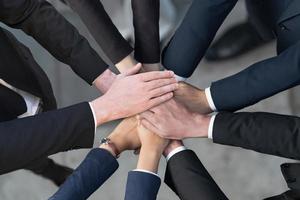 Cropped view of Group of Business people putting their hands together, Friends with stack of hands showing unity, Teamwork, Success and Unity concept photo