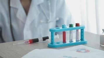 Medical Research Laboratory Portrait of a Female Scientist Wearing Face Mask Using Micro Pipette for Analysis. Advanced Scientific Lab for Medicine, Biotechnology Development. Close-up Shot video