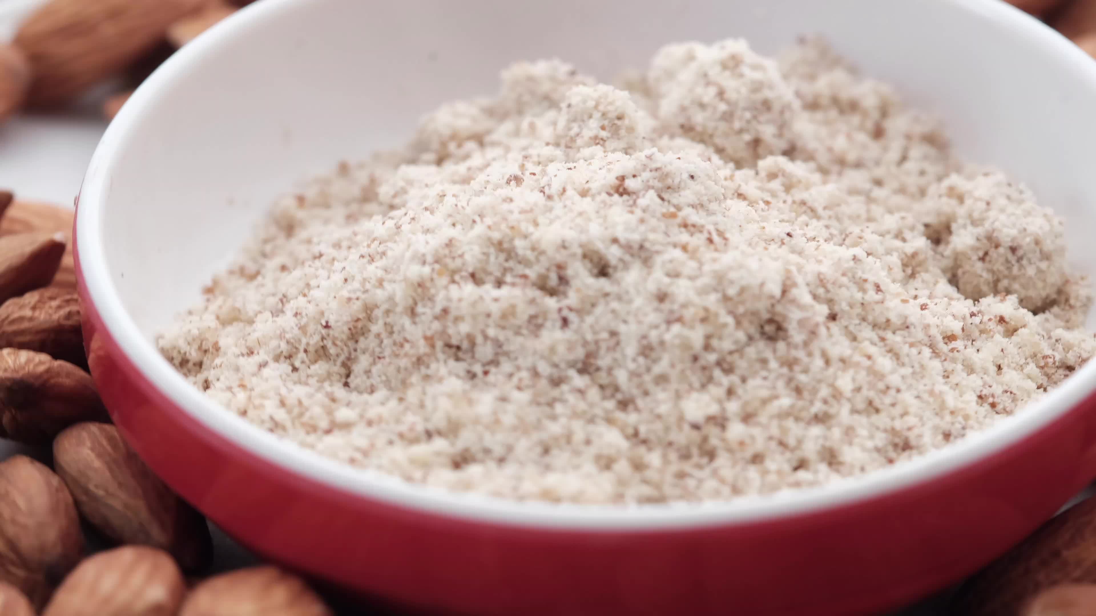 A bowl of almond flour, gluten free flour 13570903 Stock Video at Vecteezy