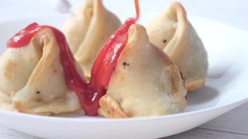 Pastry snacks with red sauce video