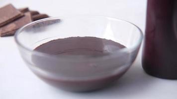 Melted dark chocolate in a glass bowl video