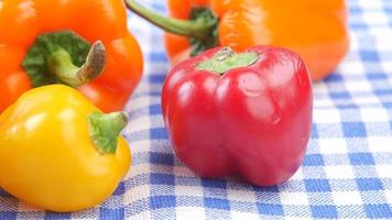 Colored bell peppers on a table cloth video
