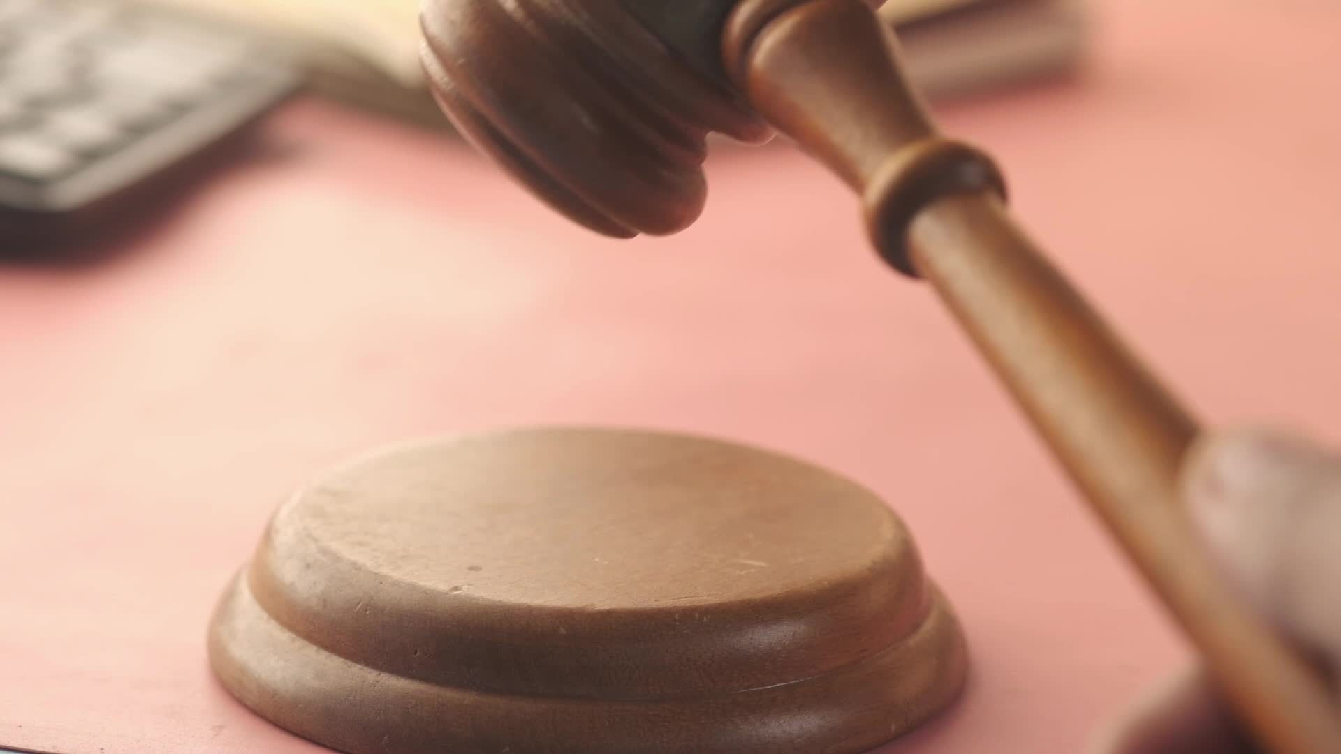 Hitting a judge hammer 13571480 Stock Video at Vecteezy