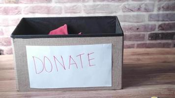 Donation box on wood table video