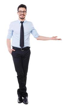 Look at that Full length of handsome young man in shirt and tie pointing away and smiling while standing against white background photo