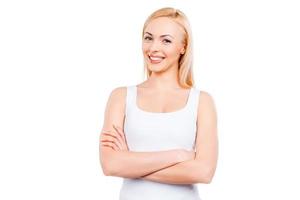 Fresh beauty. Confident mature women keeping arms crossed and smiling while standing against white background photo