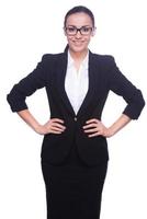 Confident business expert. Confident young woman in formalwear and eyeglasses holding hands on hip and smiling while standing isolated on white photo