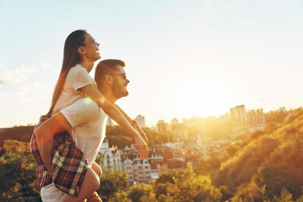 Love makes everything possible. Handsome young man giving his girlfriend a  piggyback ride while spending time together 13571900 Stock Photo at Vecteezy