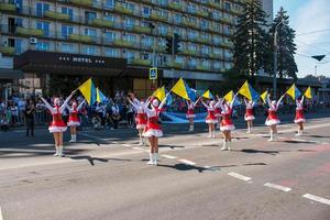 Dnipro, Ukraine - 09.11.2021 Citizens celebrate City Day. Girls dancers with waving flags of Ukraine. photo
