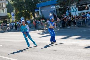 Dnipro, Ukraine - 09.11.2021 Citizens celebrate City Day. Rollerblading dancers waving the flag. photo