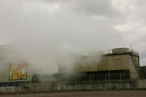 Environmental disaster. Harmful emissions into environment. Smoke and smog. Pollution of atmosphere by factory. photo