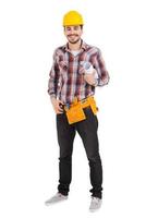 Confident repairman. Full length of confident young male carpenter in hardhat holding blueprint and smiling while standing against white background photo