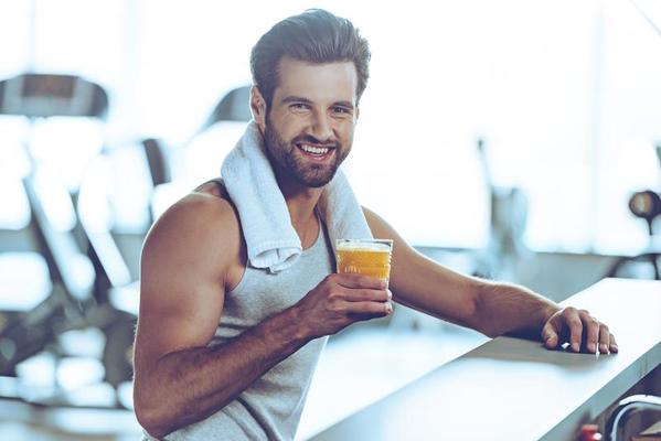 https://static.vecteezy.com/system/resources/thumbnails/013/580/423/small_2x/sip-of-freshness-after-great-workout-side-view-of-handsome-young-men-in-sportswear-holding-glass-of-fresh-orange-juice-and-looking-at-camera-with-smile-while-sitting-at-bar-counter-at-gym-photo.jpg