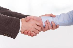 Handshake. Close-up of two business men shaking hands photo