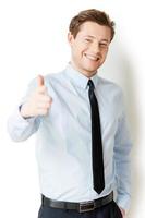 I choose you Handsome young man in shirt and tie pointing you and smiling while standing isolated on white photo